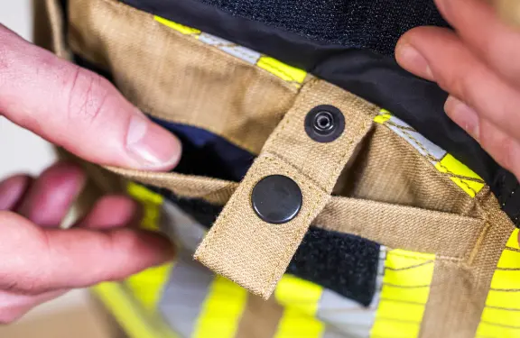 Numerous functional pockets with reinforced Kevlar puller, with carabiner loops for hanging equipment.