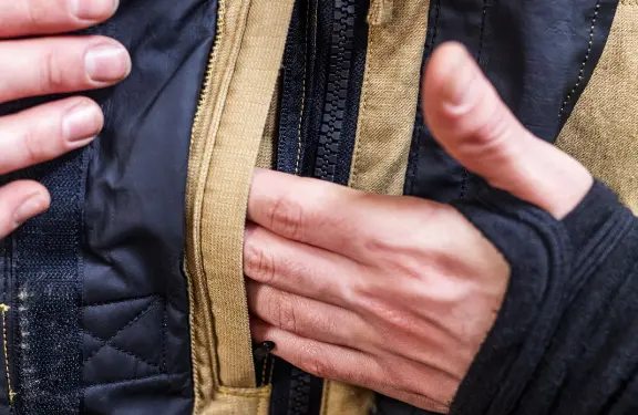  Spacious handy napoleon pocket with zipper, perfect for storing mobile phone.